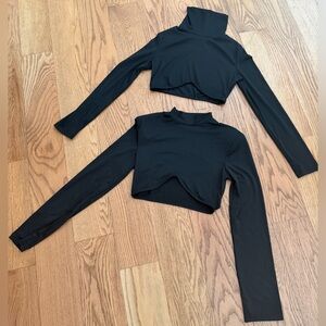 2 black tops with interesting cut